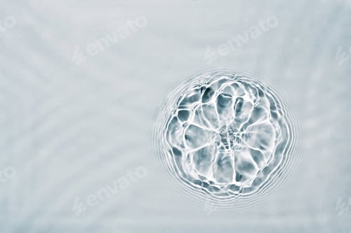 Preview: Cosmetic moisturizer micellar water. Abstract flower made from splash of liquid. Soft focus