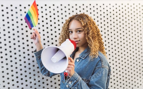 Preview: woman curly hair protest gay pride