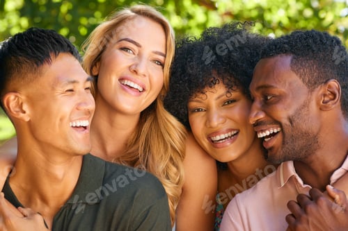 Preview: Portrait Of Multi-Racial Couple With Friends Hugging Outdoors In Countryside In Group Together
