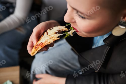 Preview: Young Girl Biting Cheese Pizza