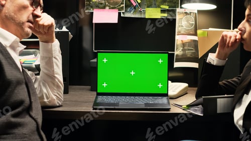 Preview: Inspectors review greenscreen on laptop
