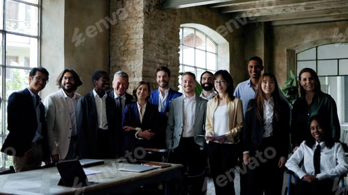 Preview: Multiracial group of business people smiling on camera inside office
