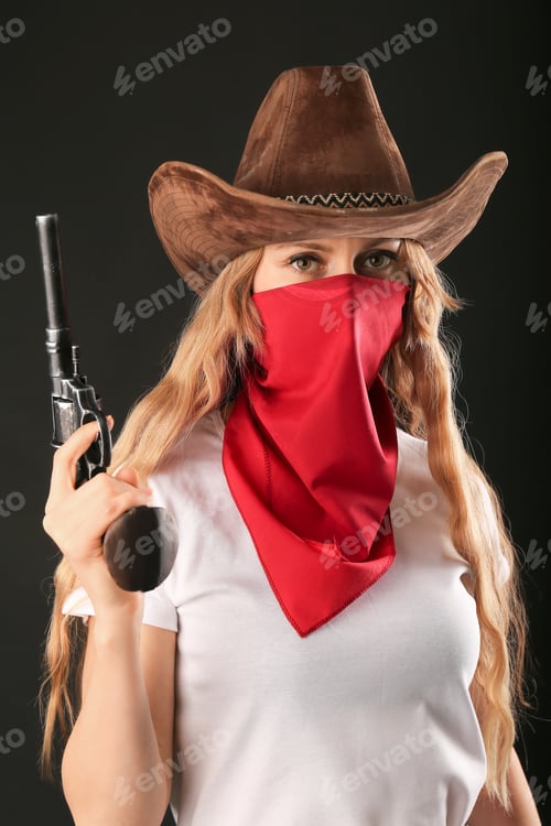 Preview: Wild cowboy girl with gun closeup with copy space