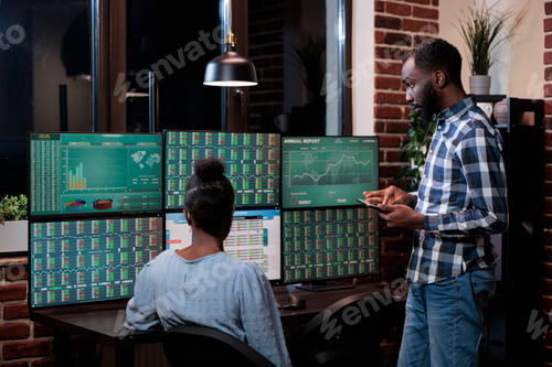 Preview: Hedge fund company agents in workspace, reviewing stock market prices highs and lows.