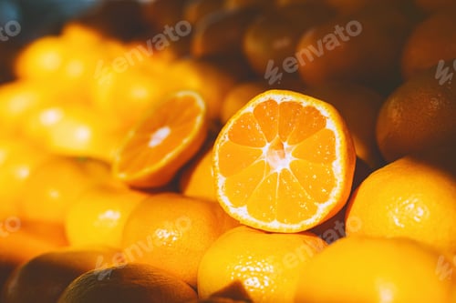 Preview: Close up of organic juicy oranges on counter at local farmers market in sunlight