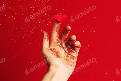 Preview: Womans Hand Holding the Small Red Heart