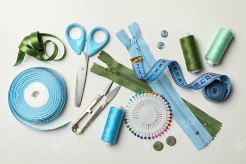 Preview: Sewing supplies on white background, top view