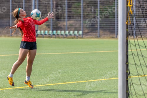 Preview: Girl on the soccer field. Soccer training. Active lifestyle. Football concept.