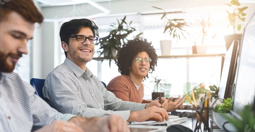 Preview: Diverse men sitting at workplace in office