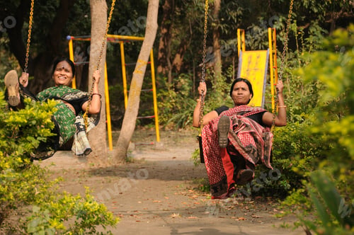 Preview: Indian woman enjoying in the public park