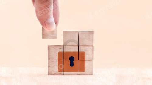 Preview: Hand putting the last piece of a wooden puzzle with a key