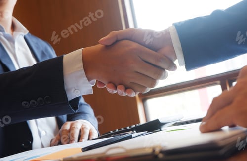 Preview: Business Deal Concluded with a Handshake in Office