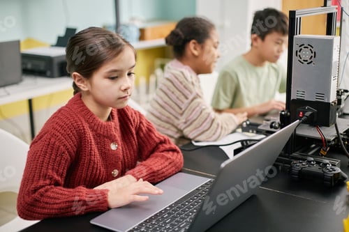Preview: Young Students Learning Coding at Computer Class