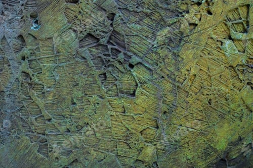 Preview: background of a rusty metallic rough surface with ocher colors and trace patterns.