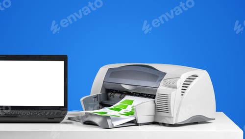 Preview: Printer and laptop on a table with blank paper ready for printing documents