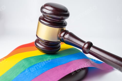 Preview: Gavel for judge lawyer on rainbow flag, symbol of LGBT pride month celebrate annual