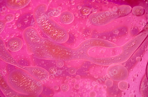 Preview: abstract pink and purple background formed by oil drops on water