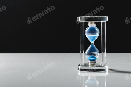 Preview: Hourglass on dark background. Macro photo. Close up