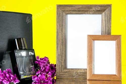 Preview: front view black expensive fragnance with picture frames on yellow background flower love present