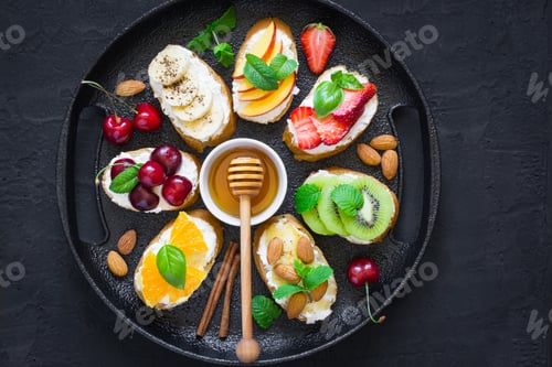 Preview: Assorted summer sweet snacks. Bruschetta or sandwiches with frui