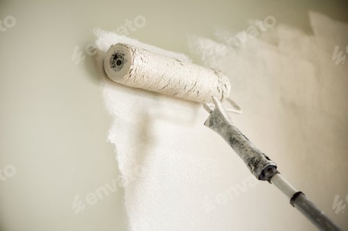 Preview: Hand painting wall with paint roller, pastel color. Appartment renovation, repair, building and home