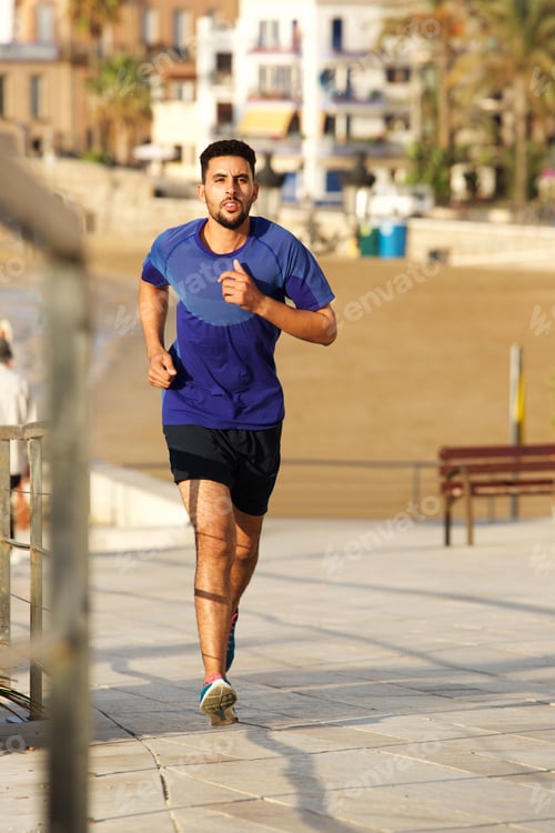 Preview: Full length young man running outdoors