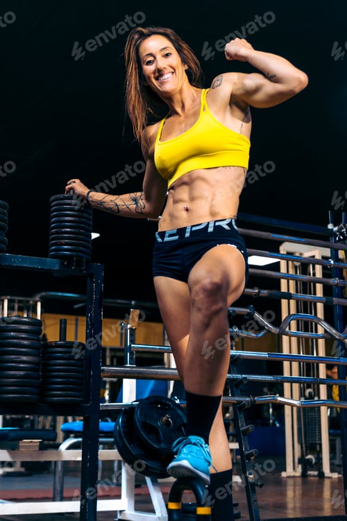 Preview: Strong Woman At Gym. Gym Dynamo: Mid-Aged Woman Inspiring Fitness Achievements