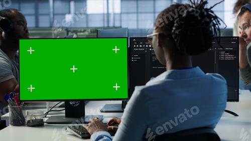 Preview: Employees monitoring energy consumption across server rigs using chroma key PC