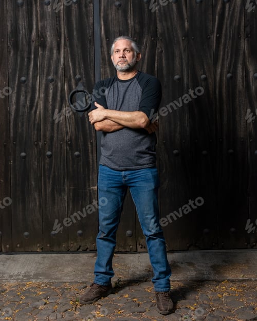 Preview: Outdoor portrait of man with gray hair.