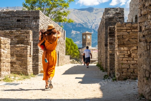 Preview: Mother with her son walking through the Ottoman castle fortress of Gjirokaster Gjirokastra. Albanian