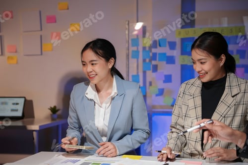 Preview: Group of young asian businesswomen discussing new project