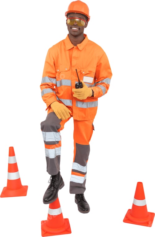 Preview: a man in orange protective gear standing next to traffic cones