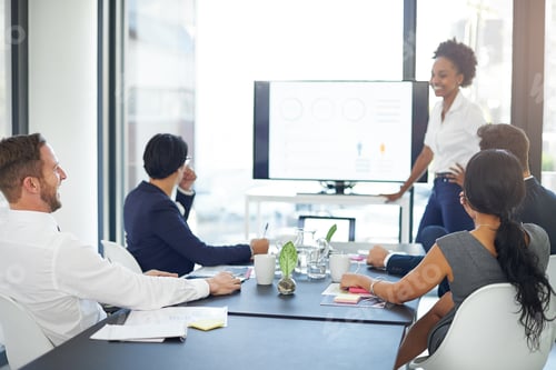 Preview: Lets review the year. Cropped shot of a businesswoman giving a presentation in the boardroom.
