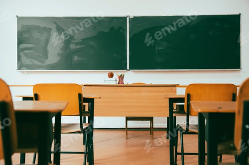 Preview: Empty Classroom Featuring Desks and Blackboard