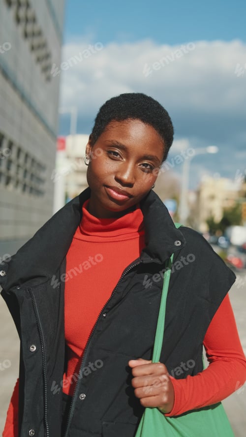 Preview: Confident Woman On Urban Street In Red Turtleneck