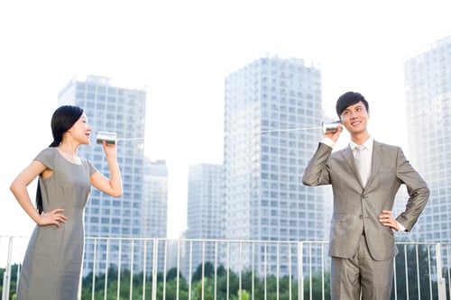 Preview: Business people with tin can phone
