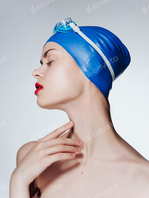 Preview: woman with bare shoulders swimming cap red lips posing sports