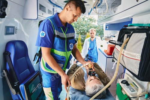 Preview: First aid, ambulance treatment. Ambulance care assistant providing medical help with artificial