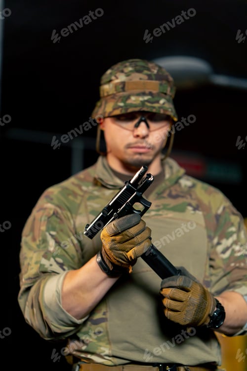 Preview: close-up at a professional shooting range a military trainer reloading a pistol ready to shoot