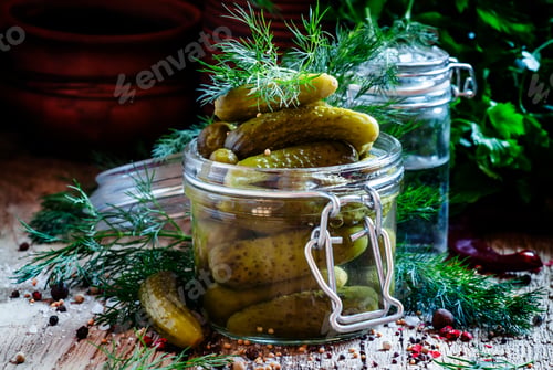 Preview: Pickled small cucumbers gherkins in a glass jar