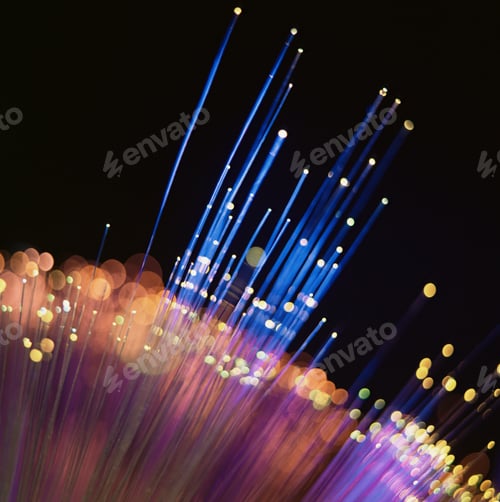 Preview: Glowing optic fibers with a bokeh effect against a dark background