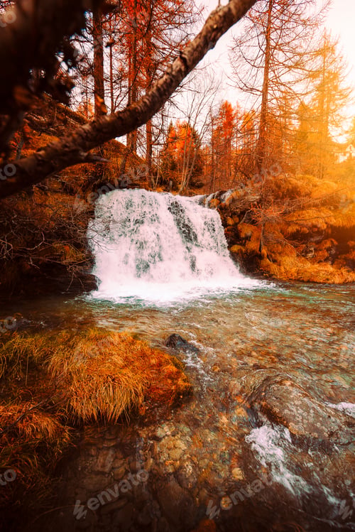 Preview: Waterfall Surrounded by Autumn Forest at Sunset, Warm Golden Tones