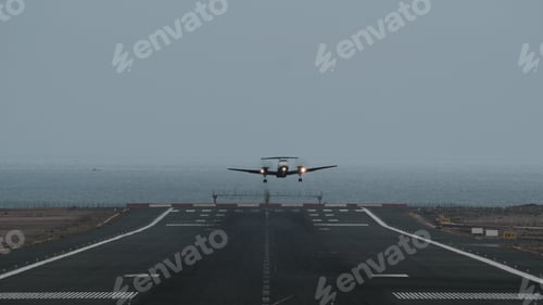 Preview: Airplane taking off from airport by the ocean