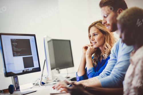 Preview: Colleagues working together in company office
