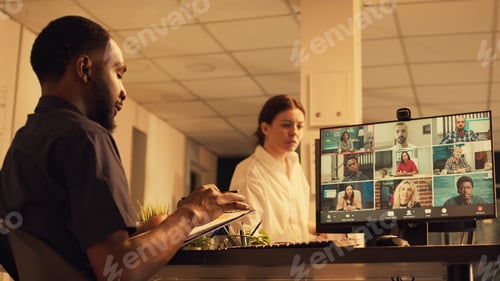 Preview: Executive employee talking to people on online videoconference