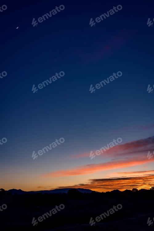 Preview: Vertical shot of beautiful sunset over a field in Santa Fe, New Mexico