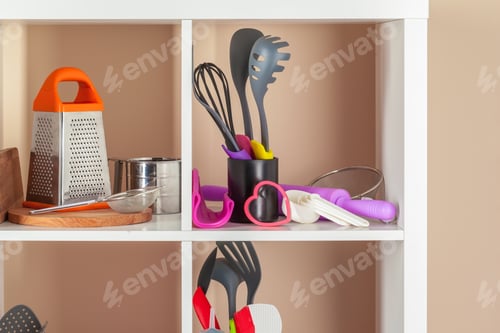 Preview: White shelving unit with set of dishware