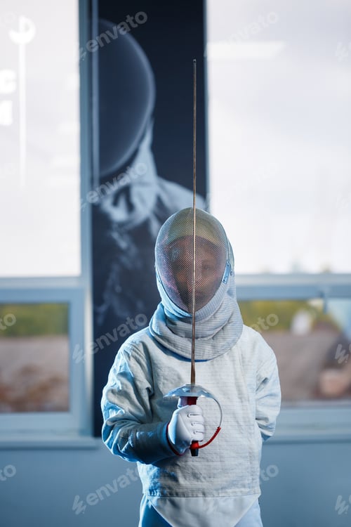 Preview: Child in a fencing costume and mask, with a sword, fencing school