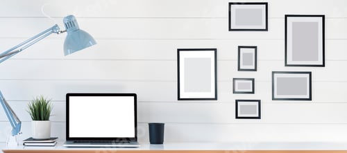 Preview: Creative workspace with blank screen laptop computer on white wooden table.