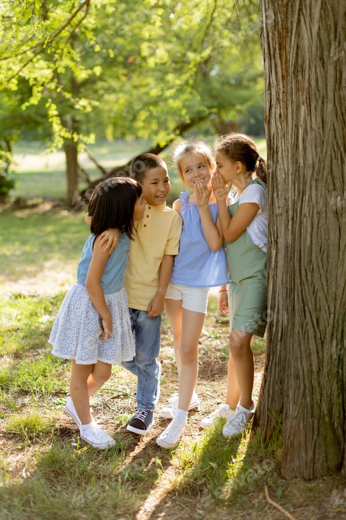 Preview: Group of asian and caucasian kids having fun in the park